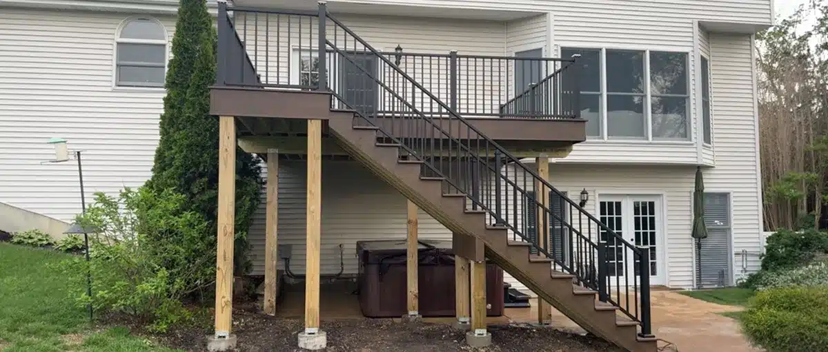 New custom composite deck with modern railing and outdoor living space built by STL Design & Build in St. Louis