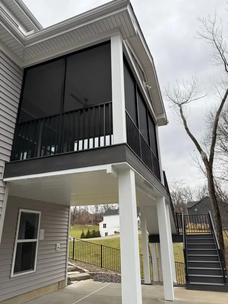 Modern elevated porch with screened walls and stairs in St. Louis, MO