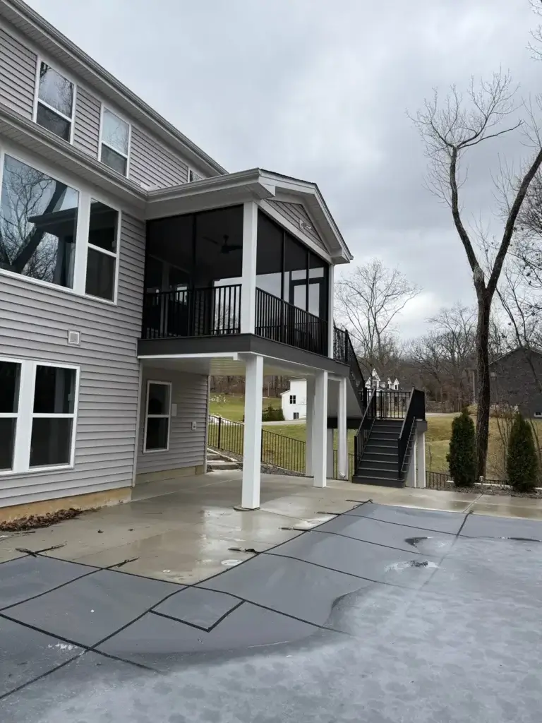 Two‑story porch with screened walls and stair access in St. Louis, MO