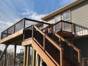 Wooden deck with stairs and railing, showcasing outdoor living renovation in Texas and Arizona